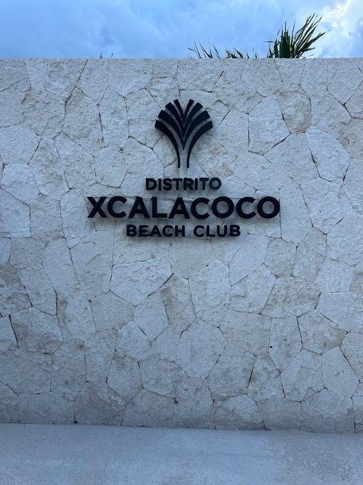 Distrito Xcalacoco Beach Club entrance sign